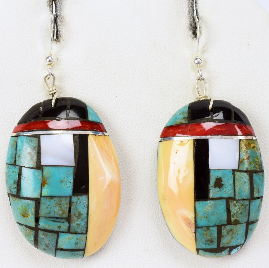 San Felipe, Bryan Tom Inlay Handmade Earrings: Measuring 2.25 inches long x 1 inch wide this artist has hand inlaid these Turquoise, Jet and Coral stones onto a shell. Done in a clean smooth finish and made by Navajo Bryan Tom. Weigh 15.6 Grams. N