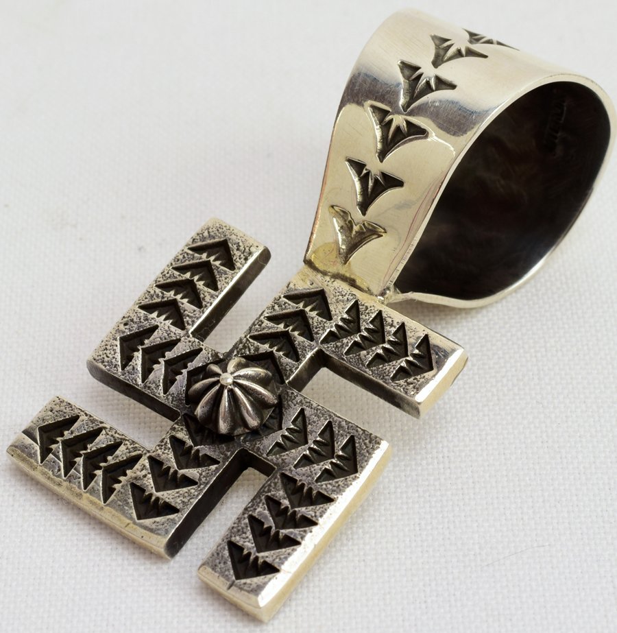 Sunshine Reeves Sterling Silver Whirling Log Penant: Well known as a Master Silversmith Sunshine and award winning Reeves is the Artist that made this pendant. It measures 2 3/8 inches long x 1 1/8 inches wide. It is Deeply hand stamped and in The "Whir