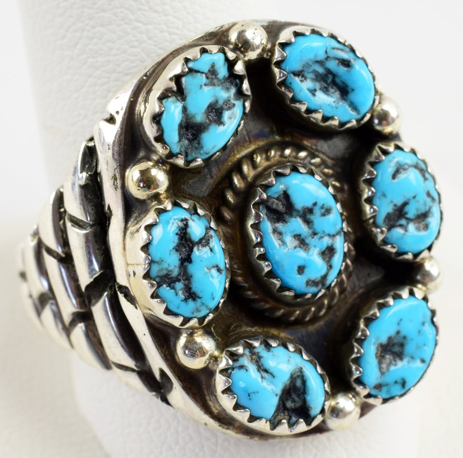 Navajo Sterling Turquoise Nugget Men's Ring-T. Hasteen: Measures 1 inch across the top with bezel set Natural Turquoise Nuggets and bead accents. The sides and band is done in Stacked or Cobblestone style Sterling Silver. Stamped Sterling and Signed "T. Ha