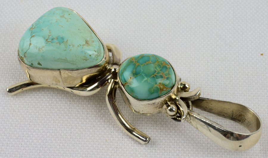 Navajo Sterling Turquoise Beetle Pendant-P. Livingston: The Cutest bug you will ever have. Measures 2 1/8 inches long with two Natural Turquoise pieces in the body. This Pendant is a Beetle and has Sterling Legs and eyes. Stamped Sterling and Signed "Paul 