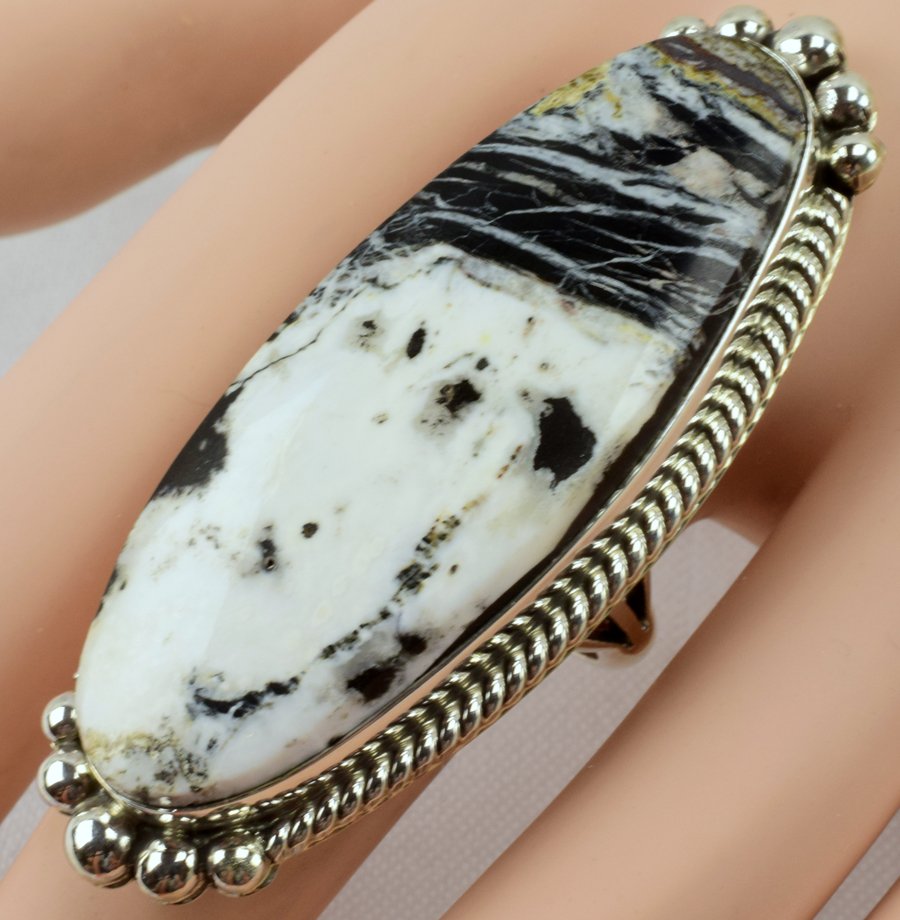 Navajo White Buffalo Turquoise Ring-Alfred Martinez: Measures 2 3/8 inches in length with a large Natural White Buffalo Turquoise Center stone. The stone has a rope and Grams and is a Size 9. Native American, Navajo, Southwestern Indian Jewelry.