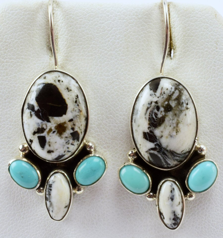 Lea Sandavol Turquoise & White Buffalo Turq. Earrings: Measuring 1.75 inches with the hook drop these have a White Buffalo Turquoise Center Stone and accented with Turquoise Cabochons. The earrings have a simple sterling frame, Stamped Sterling and Signed