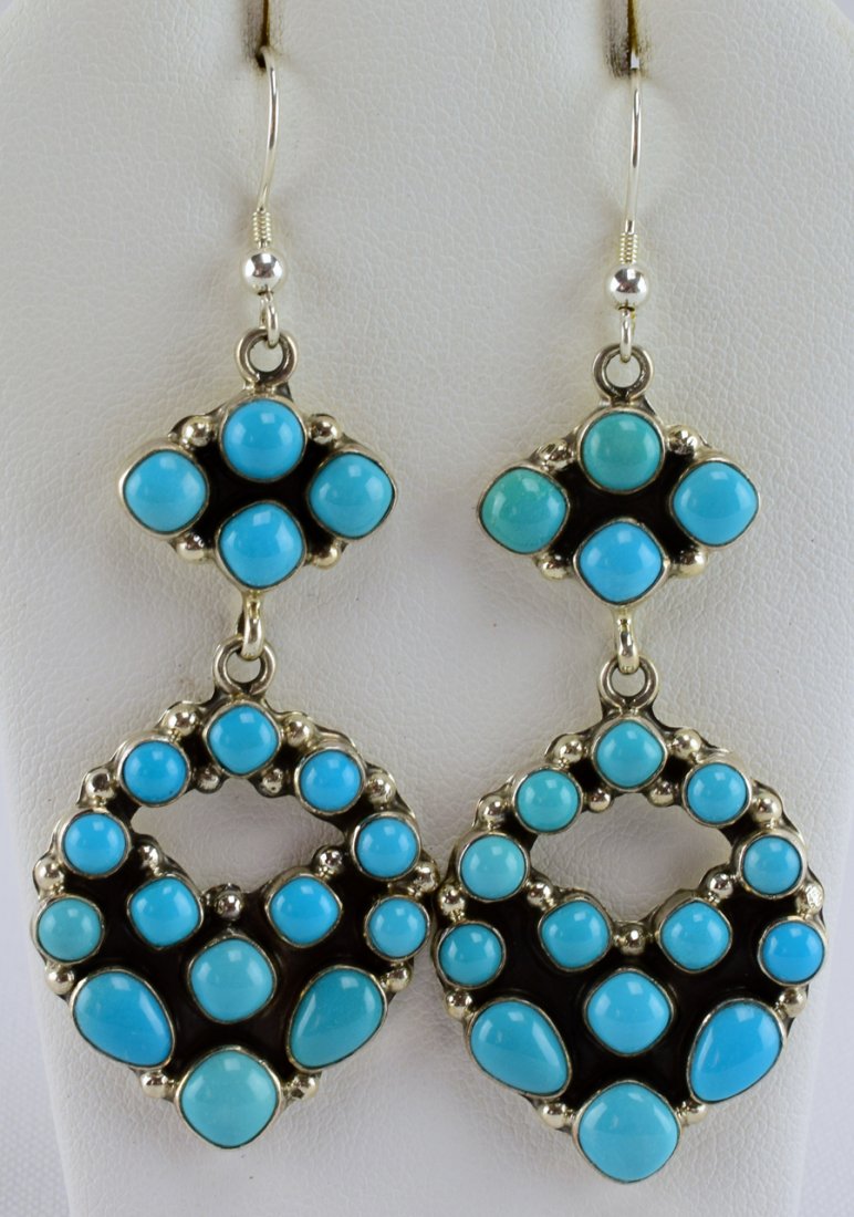 Emma Lincoln Sterling Sleeping Beauty Turquoise Earring: Measures 3 inches in length with the hook drop. These earrings were made by the Master Artist Emma Lincoln with Sleeping Beauty Turquoise Stones. Back of one is Stamped Sterling and Signed "Emma Linco