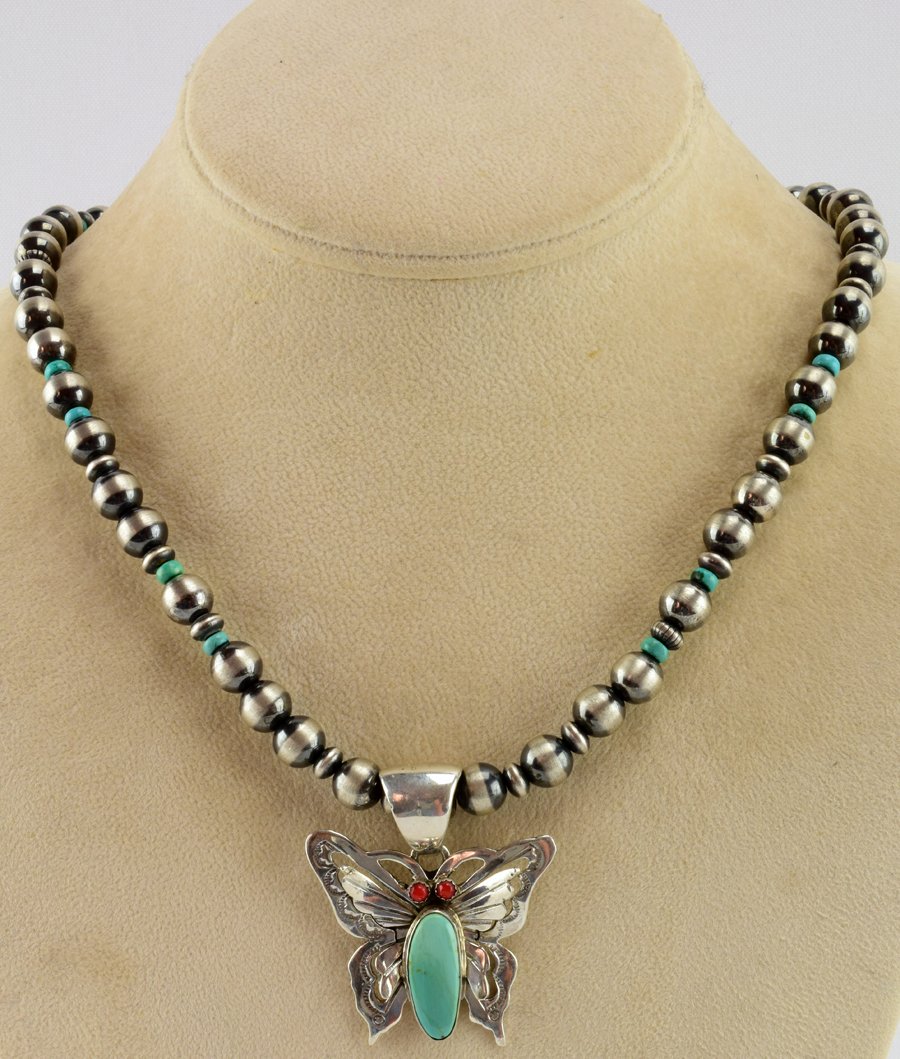 Russell Sam Sterling Bench Bead and Butterfly Necklace: The chain portion is 19 inches in length with a hook closure and has 8 mm. Bench beads along with smaller Sterling and Turquoise bead spacers. The Butterfly Pendant measures 1 5/8 inches tall x 1.5 in