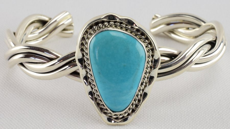 Samuel Yellowstone Sterling Sornoran Turquoise Bracelet: Measures 1.25 inches across the top with a Natural Blue Turquoise Center stone. The piece has a rope design around the stone and a heavy gauge twisted band. Inside measures 5.5 inches plus a gap of 1 