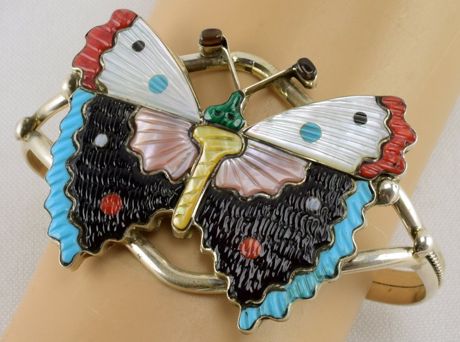 Zuni, Tamara Pinto Sterling Inlay Butterfly Bracelet: Measures 1.75 inches wide and done in an inlay Butterfly style. This bracelet style has been handed down and taught through the family. It has inlay of Turquoise, Jet, Coral and shell. Inside measures