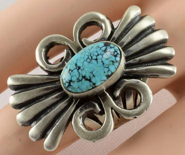 Navajo Sterling Blue Moon Turquoise Ring L. James: Measuring 1.5 inches long x 1 inch wide this ring has a beautiful Blue Moon Turquoise Natural Center Stone. Done in a heavy gauge Polished Sterling the piece has a 6 way split band which comes