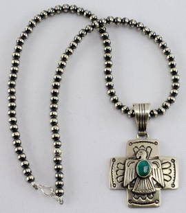 Native American Sterling Kingman Thunderbird Necklace: Chain portion measures 18 inches in length and is made with 2 mm. Bench beads and has a hook closure. The pendant measures 2.5 inches long x 1.5 inches wide. It has a stamped background and a