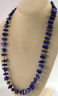 Chunky Lapis and Heishi Necklace by Jennifer Correa: Measuring 25+ inches in length this necklace has Natural Lapis polished pieces accented with heishi beads. The lapis pieces are approx 10 to 12 mm in size. The necklace is finished with a 6 mm. Sterli