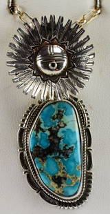 Bennie Ration Sterling Silver Kachina Pin/Pendant: Measuring 2.75 inches in length this piece has an articulating Kachina head and a wonderful Natural Turquoise stone below. The Turquoise stone measures 1 3/8 inches in length and has a rope and