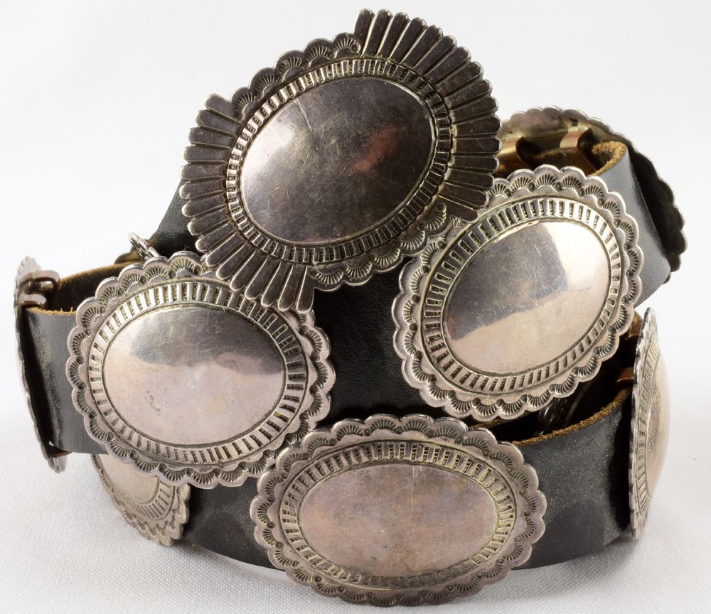Navajo Old Pawn Sterling Silver Concho Belt-Wauncka: The leather measures 41 inches long and has 14 Sterling dome concho pieces with a scallop edge and hand stamping. Each concho is 1 7/8 inches wide x 1.5 inches tall. The buckle measures 2 1/8 inches l