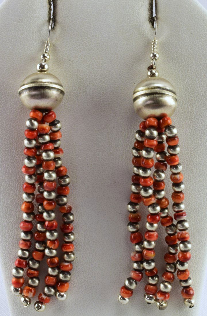 Robert Johnson Spiny Oyster & Bench Bead Earrings: Measuring 3.75 inches long with the Hood Drop these earrings have a round Bench bead at the top that is 14 mm. in size. The dangle spiny oyster and bench beads hang from that and are 3 mm. in size. St