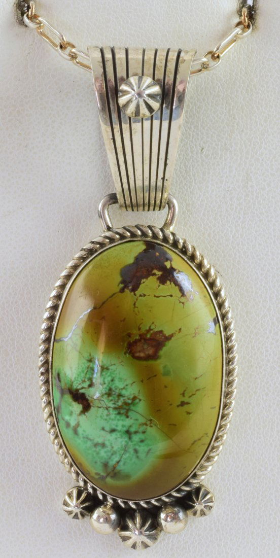 Halrey Jake Masterpiece Royston Turquoise Pendant: Measuring 2 7/8 inches long x 1 1/8 inches wide this Pendant has an Amazing thick Natural Royston Turquoise center Stone. It has a grooved bale and a rope frame with concho and rain drop beads at the