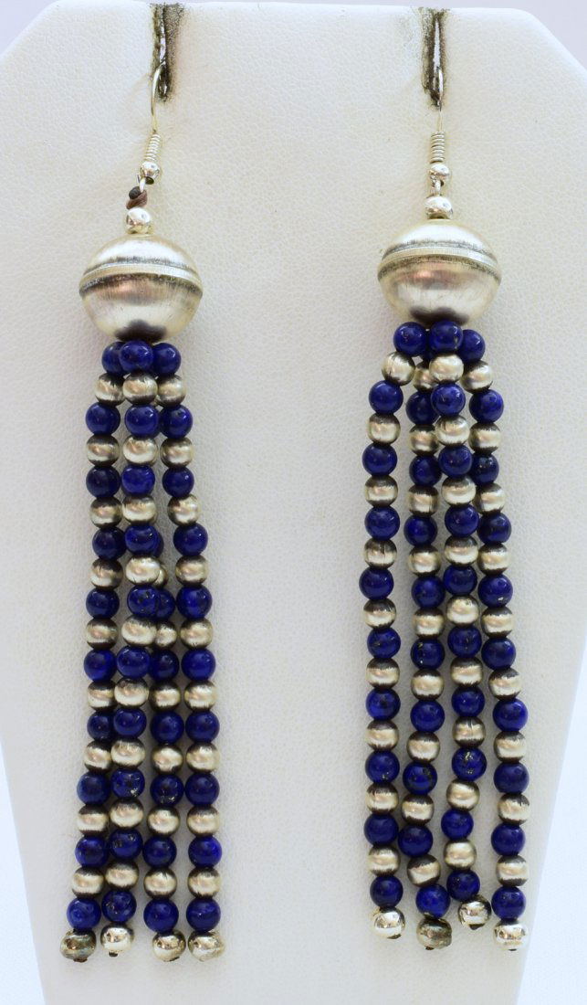 Robert Johnson Sterling Lapis and Navajo Pearl Earrings: Measuring 4 inches in length these earrings have a Round Bench bead at the top which is 14 mm. in size with 4 strands of Navajo Pearls and Lapis bead alternating below. The lapis and bench beads measu