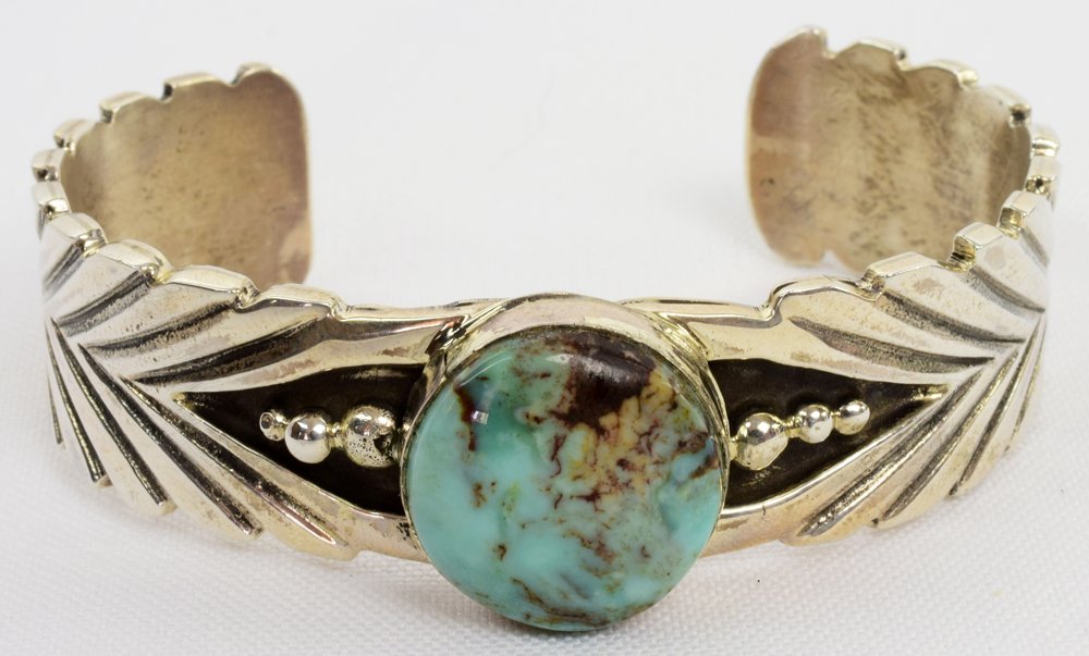 Native American Carico Lake Turquoise Bracelet: Measures 3/4 inch wide with a Natural Turquoise Center stone and a heavy Stamped Sterling Band. The inside measures 5.25 inches plus a gap of 1.25 inches. Stamped Sterling and Signed "Jason B". Weighs