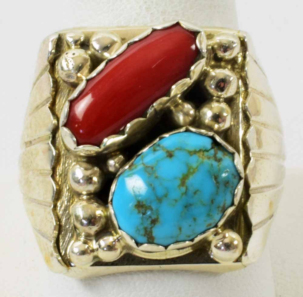 Avery Smith Sterling Turquoise and Coral Men's Ring: Measures 1 inch long x 3/4 inches wide. This piece has a Natural Turquoise and a Natural Coral Nugget which are accented with bead work across the top. The sides have applied grooved design. Stamped S