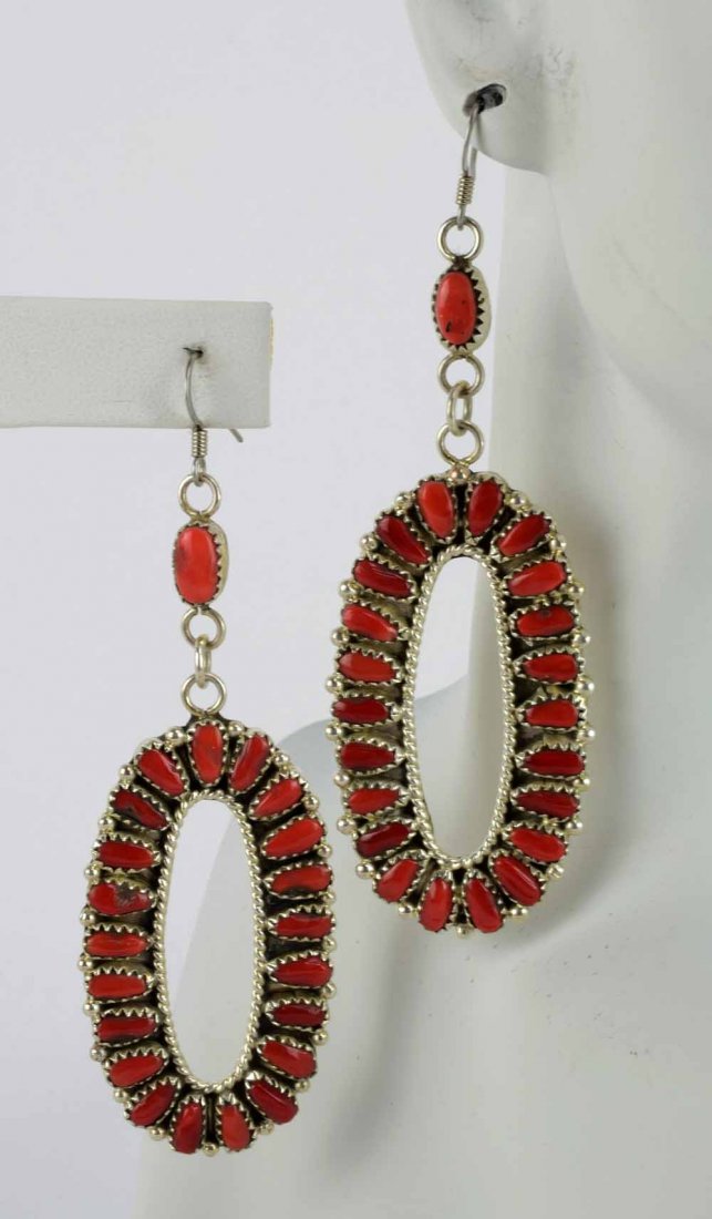 Native American Sterling Long Coral Earrings: Measures 3.75 inches in length x 1.25 inches wide. These earrings have a lot of movement and are Coral. There is a single piece that sits above the drop and then the oval drop has 22 pieces in each ea