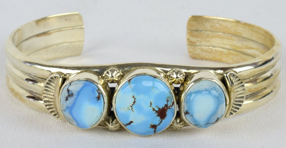Thomas Francisco Sterling Golden Hills 3 Stone Cuff: Measures 3/4 inch wide with 3 Natural Golden Hills Turquoise Stones across the top. The stones are accented with rain drop beads. Inside measures 5.75 inches plus a gap of 1 inch and is slightly adjus