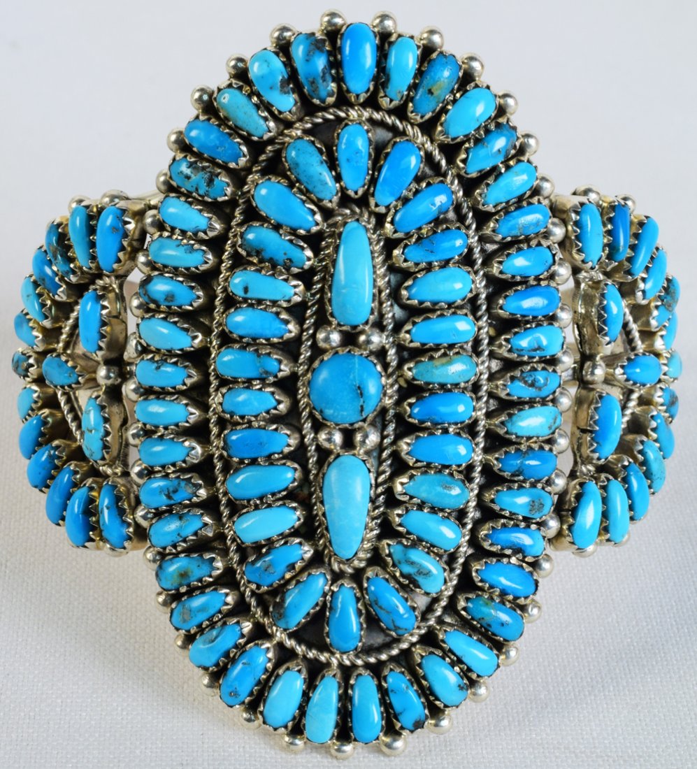 Justina Wilson Sleeping Beauty Turquoise Cluster Cuff: Measuring 2.75 inches in length this is an elaborate Cluster bracelet made of Sleeping Beauty Turquoise in a Petit-point style. The bracelet has over 40 pieces hand cut and set in one row. This is a r