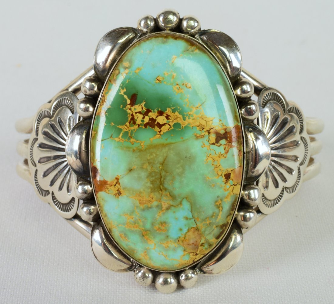 Mary Ann Spencer Royston Turquoise Cuff Bracelet: Measures 2.25 inches wide with a Natural Domed Royston Turquoise Center stone. The stone is accented with bead and scallop work and has a decorated band. Inside measures 5.5 inches plus a gap of 1.5 i
