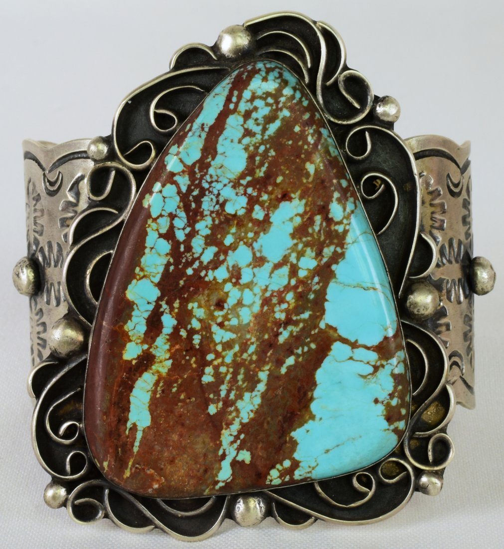 Chimney Butte Sterling Huge No. 8 Turquoise Bracelet: Measures 3.5 inches wide. This is one of the largest bracelets we have offered. It has a band that is 1 7/8 inches wide, completely hand stamped with Round Bead work. The Center stone measures 2.75 x 