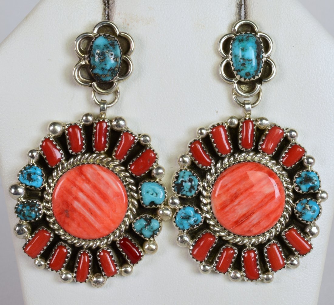 Justin Wilson Spiny Oyster, Turquoise & Coral Earring: For pierced ears. These measure 2.5 inches long x 1.5 inches wide. They have Natural Turquoise and Coral surrounding a Spiny Oyster center Stone. The earrings are expertly hand crafted and have small 