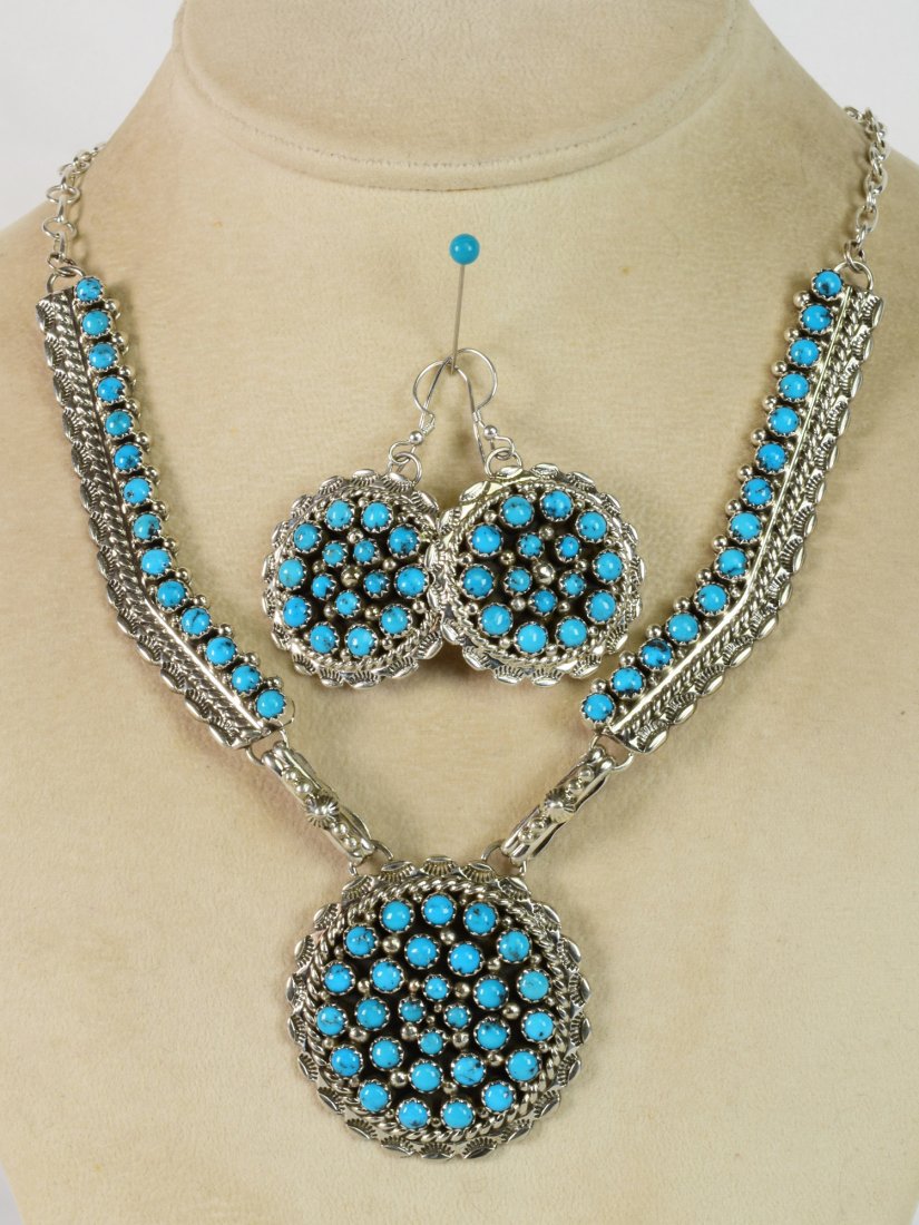 Navajo Sterling Sleeping Beauty Necklace & Earring Set: Necklace measures 19+ inches without the Pendant drop. The piece has a link chain at the neckline and a 3 Inch "bar" on each side with bezel set Sleeping Beauty Turquoise Stones. The pendant drop also