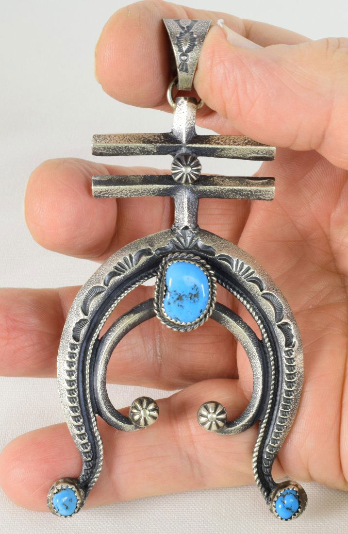 Kevin Billah Sterling Tufa Cast Naja Pendant w/Turquois: Pendant Only - Measuring 4.5 inches long x 2.5 inches wide this piece is done in a Tufa cast style. It has the double Cross section at the top and then drops into a Naja style which is accented with K