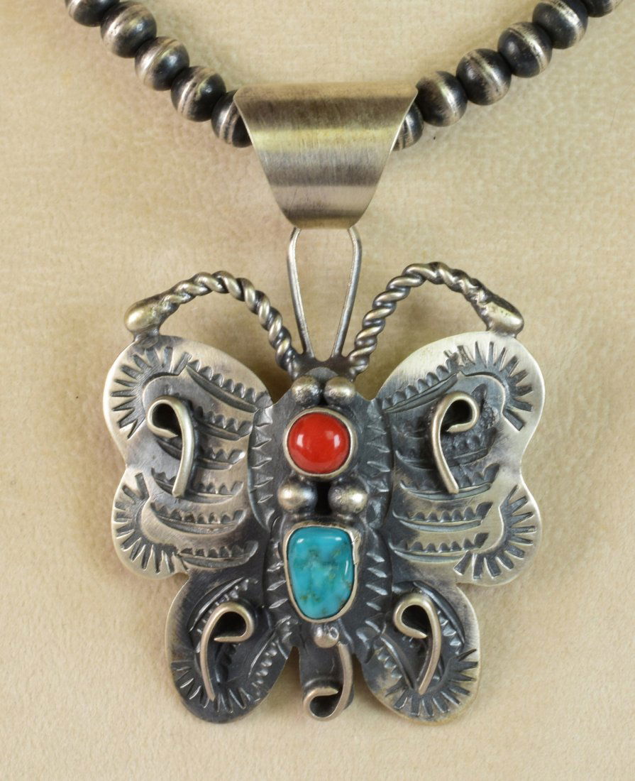 Chimney Butte Sterling Turquoise & Coral Pendant: Pendant Only - Measures 2.75 inches long x 2.25 inches wide this pendant is made in a Butterfly shape with a Natural Turquoise and Coral piece. The back is also hand stamped and has sterling design wo