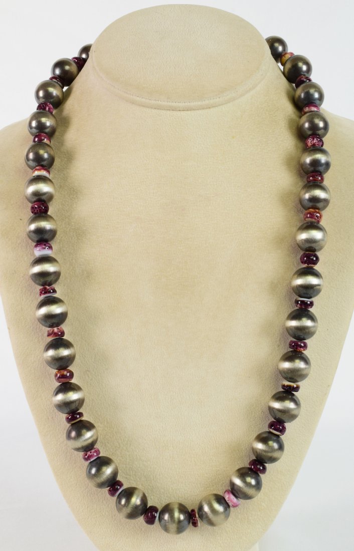 Native American Navajo Pearl & Spiny Oyster Neklace: Measures 24 Inches long without the hook closure. The Navajo Pearl Beads are 14 mm in Size and are separated by a Polished Spiny Oyster Bead that is 7 mm in size. The necklace has a Hook Closure and h