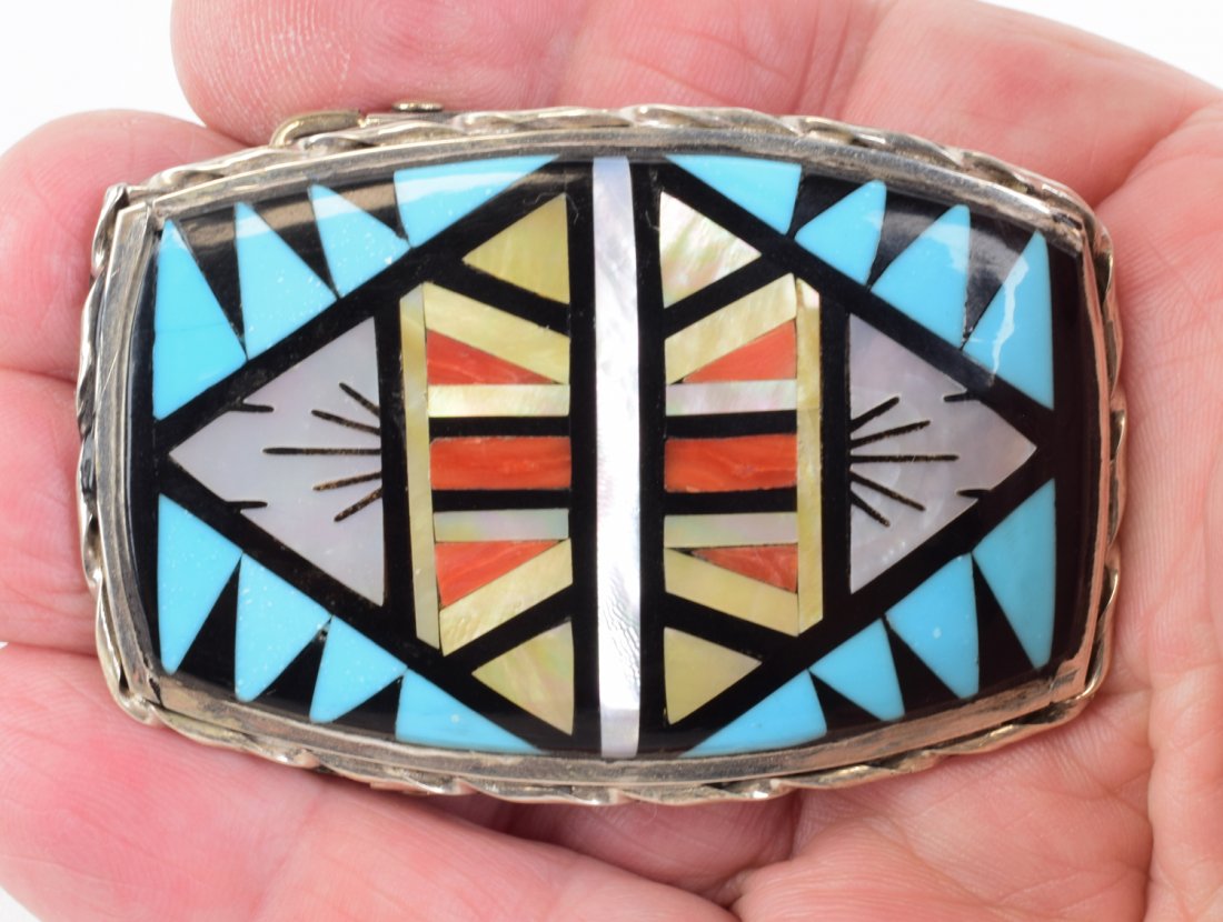 Zuni, G.M. Booqua Multi-Stone Inlay Men's Belt Buckle: Measures 2.75 inches wide x 2 inches tall with a 1.75 inch Keeper. This piece has hand inlay of Turquoise, Mother of Pearl, Jet, and Coral. Stamped Sterling and Signed. Weighs 36.6 Grams. Native Ameri
