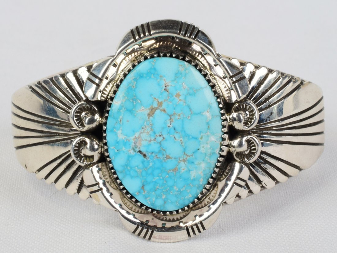 Joelias Draper Sterling Morenci Turquoise Brancelet: Measures 1.75 inches wide this bracelet is made with a Beautiful Morenci Turquoise Center stone. The stone is accented with a heavy frame of bead, and notched designed work and the band has been cover