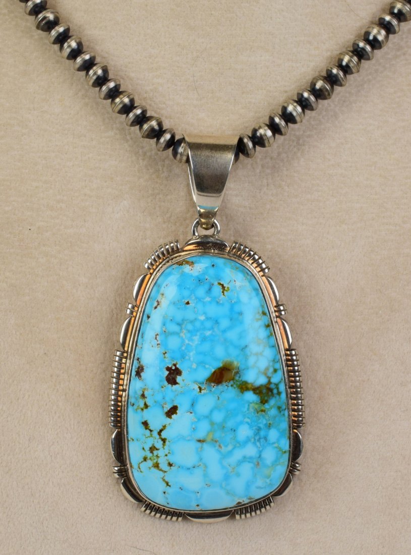 Rick Tolino Sterling Morenci Turquoise Pendant: Pendant Only - Measures 2.75 inches long x 1.5 inches wide. This pendant has a Beautiful Natural Morenci Turquoise Center stone that measures 2 inches in length. The Center stone has light and dark bl