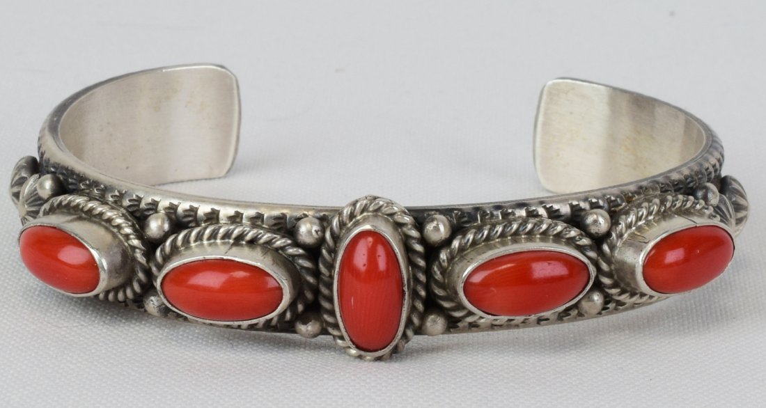 M & R Calladitto Sterling Mediterranean Coral Cuff: Measures 1/2 inch wide. This bracelet is very well made and finished. It has 5 Mediterranean Coral pieces across the top which are bezel set and have a rope and bead frame. The inside measures 5.75 in