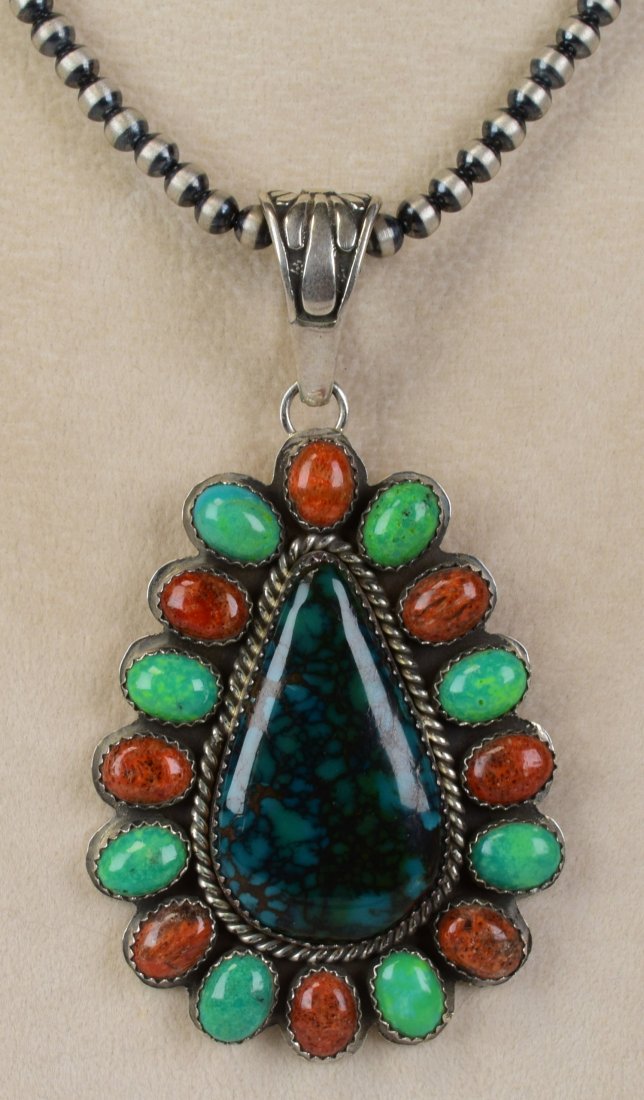 Daniel Mike Dark Green Nevada Turquoise Pendant: Pendant Only - Measures 3 inches long x 1.75 inches wide. This pendant has a Beautiful Dark Greenish {almost} black Turquoise center stone that has lighter green turquoise and Spiny Oyster halo pieces