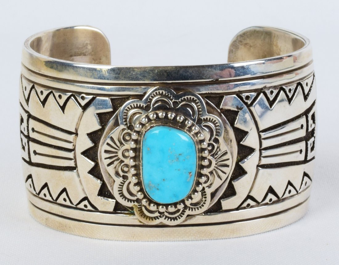 E. Wylie Castle Dome Turquoise Overlay Bracelet: Measures 1.5 inches wide all around with a Beautiful Castle Dome Natural Turquoise Center stone. The stone has a bead frame and is placed in the center of a completely decorated band The band is hand 