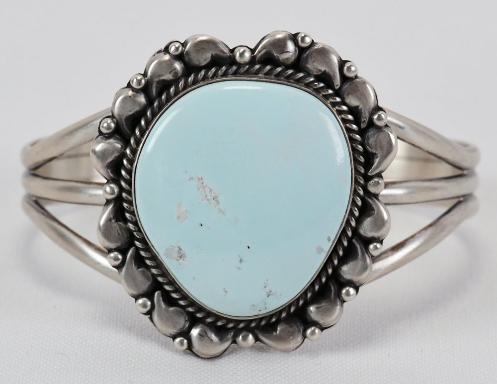 E. Richards Sterling Dry Creek Turquoise Bracelet: Measures 1.75 inches wide with a Natural Dry Creek Turquoise center stone accented with Sterling bead and scroll work. Inside measures 5.5 inches plus a gap of 1.25 inches. Sterling Silver, Signed and