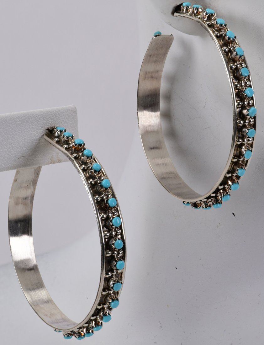 Zuni, Joaan Cheama Sterling Snake Eye Hoop Earrings: For pierced ears these earrings are 2 inches in diameter. They have 28 tiny pieces of Natural Turquoise in each earring. The pieces of turquoise have been precisely cut and set to make this pattern wh