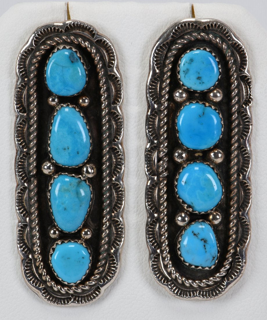 Julia Etsitty Kingman Turquoise Nugget Earrings: For pierced ears these measure 2 inches in length x 3/4 inch wide. They have 4 polished Kingman Turquoise nuggets in the center and are accented with a rope and scallop frame. Sterling, Signed and Wei