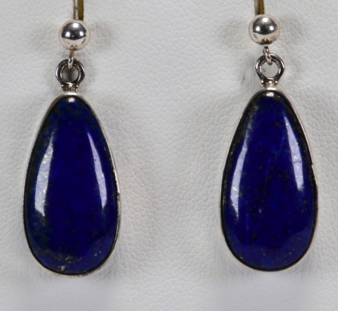Native American Sterling Lapis Drop Earrings: For Pierced Ears these earrings measure 1.25 inches in length and are in a Tear drop shape. They have a tiny bead that sits on the ear lobe and then drop into the Natural Lapis at the bottom. Stamped