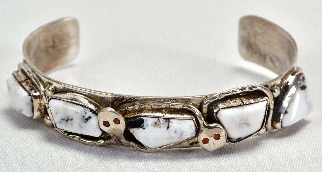 Jude Candelaria, Zuni White Buffalo Snake Bracelet: Measures 1/2 inch wide and has 5 Freeform Pieces of White Buffalo Turquoise across the top. Each Turquoise piece has the snake winding through the stones. Inside measures 5.25 inches plus a gap of 1.5