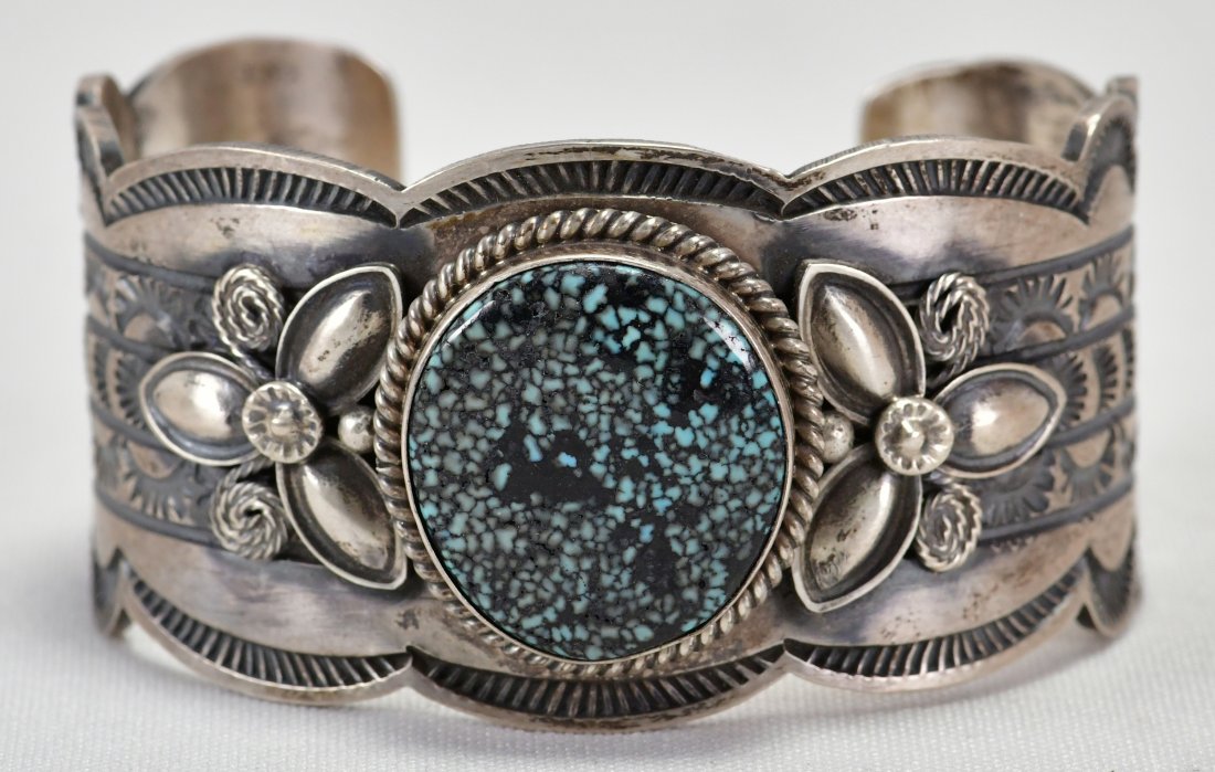 Mary Ann Spencer Kingman Waterweb Turquoise Cuff: Measures 1.5 inches wide all around with a hand stamped band and scallop edge. This bracelet has a Natural Kingman Water Web Turquoise center stone. Inside measures 5.5 inches plus a gap of 1.25 inche