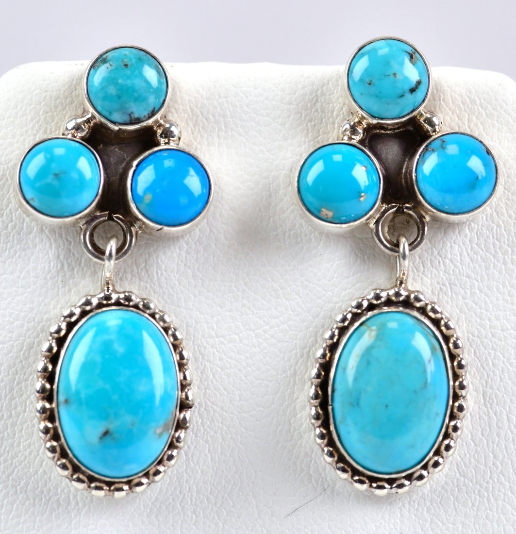 Navajo Sterling Blue Ridge Turquoise Cabochon Earrings: For pierced ears - These earrings measure 1.5 inches in length and are 3/4 inch wide. They have amazing polished blue Natural Turquoise cabochon pieces that are accented with a tiny rope frame. Sterli