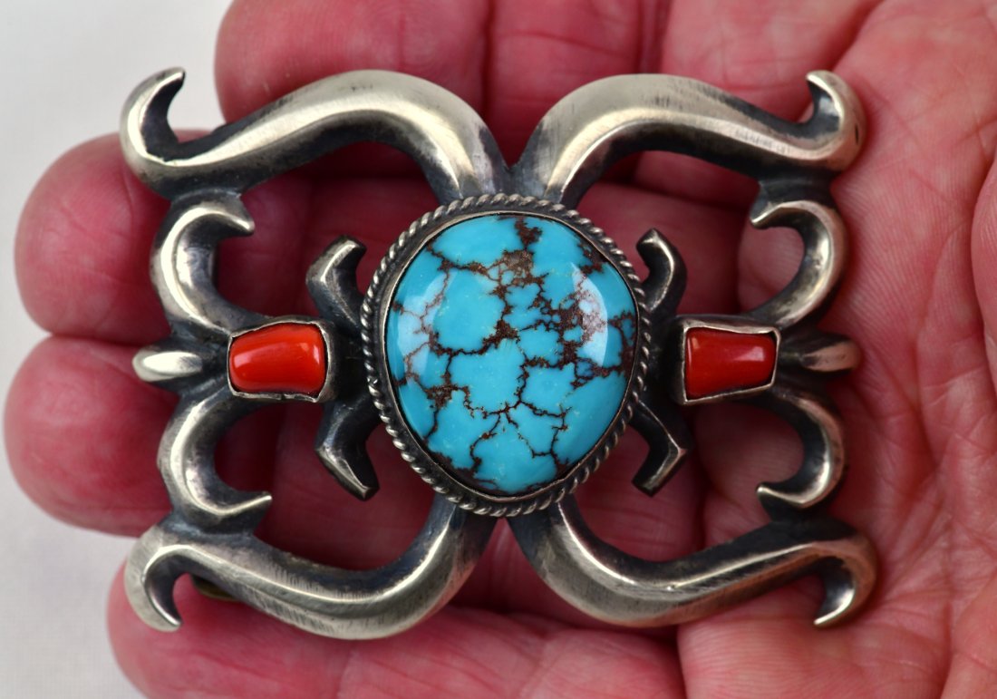 Native American Sterling Sand Cast Turquoise & Coral Buckle: Measures 3 inches wide x 2.25 inches tall. This buckle is done in a Sand Cast Style with Natural Turquoise and Coral accents. Sterling/Signed and Weighs 64.8 Grams. Native American, Navajo, Southweste