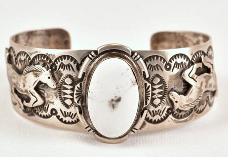 LeRoy James White Buffalo Turquoise Horse Cuff: Sterling Silver| LeRoy James White Buffalo Cuff w/Horses on band| Inside measures 5.75" plus a gap of 1.25" - Total 7 inches| Face Width 1.25"| Signed| Weighs 41.9 Grams| Native American, Navajo, Sout