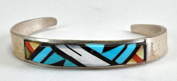 Zuni, C.H. Booqua Sterling Multi-Stone Inlay Bracelet: Sterling Silver| C. H. Booqua Sterling Silver Multi-Stone Inlay Bracelet| Genuine Turquoise, Jet, Mother of Perl and Coral| Inside measures 5.25" plus a gap of 1.25" - Total 6.5"| Face Width 1/2"| Sig