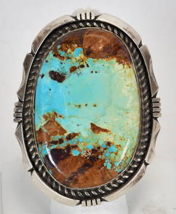 Eddie Secatero Sterling Silver Number 8 Turquoise Large Ring: Sterling Silver| Eddie Secatero Sterling Silver Number 8 Turquoise Large Ring| Genuine Number 8 Turquoise| Measures 2.25" Long x 1.75" Wide| Hallmarked "ES"| Weighs 44.4 Grams| Size 8.75| Native Ameri