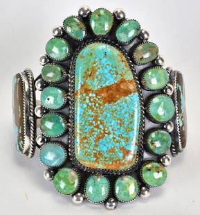 Marcus Chavez Sterling Silver Number 8 Turquoise Cuff Bracelet: Sterling Silver| Marcus Chavez Sterling Silver Number 8 Turquoise Cuff Bracelet| Genuine Number 8 Turquoise| Inside measures 5.5" plus a gap of 1.25" - Total 6.75"| Face Width 3.5"| Signed| Weighs 135