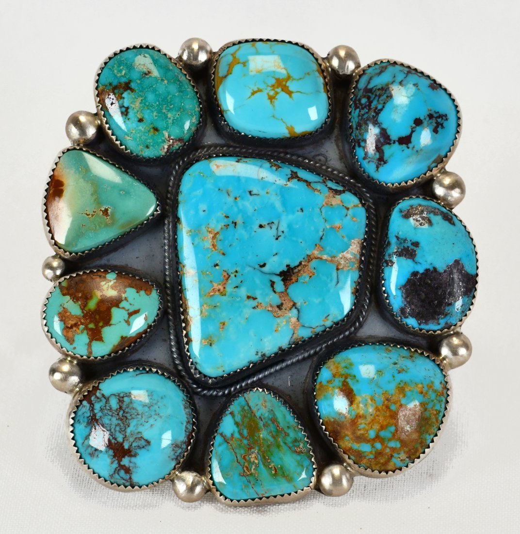 Phillip Yazzie Sterling Huge Turquoise Mountain Turquoise Bracelet: Sterling Silver| Phillip Yazzie Huge Turquoise Mountain Turquoise Bracelet| Genuine Turquoise Mountain Turquoise| Inside measures 5.5" plus a gap of 1.25" - Total 6.75"| Face Width 3"| Hallmarked "PY"