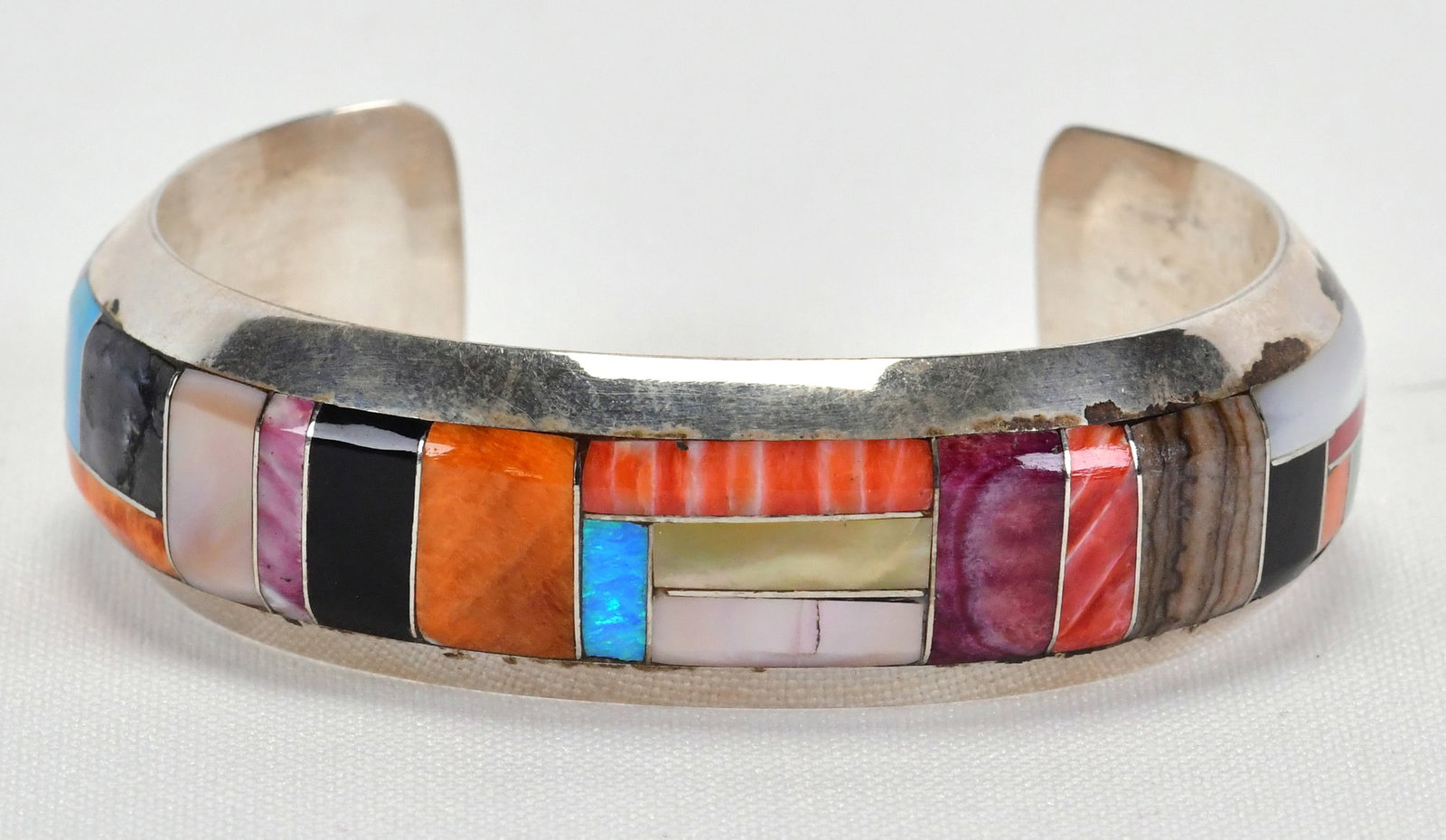 Navajo Vintage Sterling Silver Multi-Stone Inlay Cuff Bracelet: Sterling Silver| Navajo Vintage Sterling Silver Multi-Stone Inlay Cuff Bracelet| Genuine Turquoise, Spiny Oyster, Mother of Pearl, Jasper. Coral and Jet| Inside measures 5 1/8" with a gap of 1 1/8} - 
